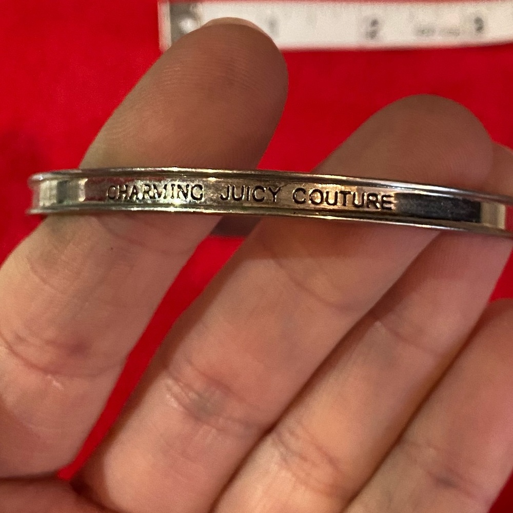 Juicy Couture bangle bracelet. Silver color